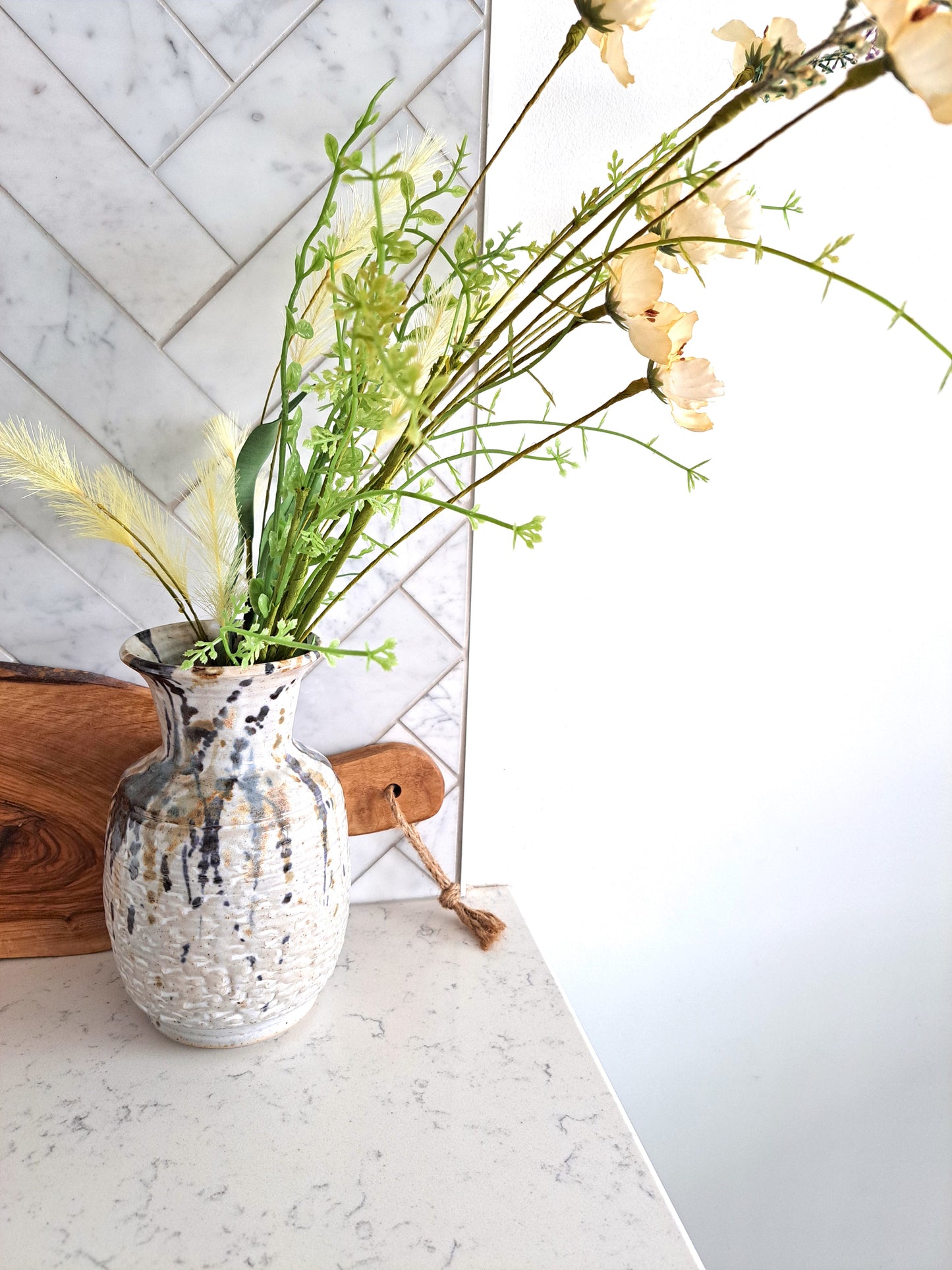 Weathered Landing's handmade ceramic splash vase. Artist signed pottery made in Canada. A great way to showcase your florals and stems. Beautiful for an urban, modern, and contemporary home. Find a variety of home decor, plants and art prints at Weathered Landing. Located in Komoka, Ontario, local delivery is available. Shipping to Canada and the US.