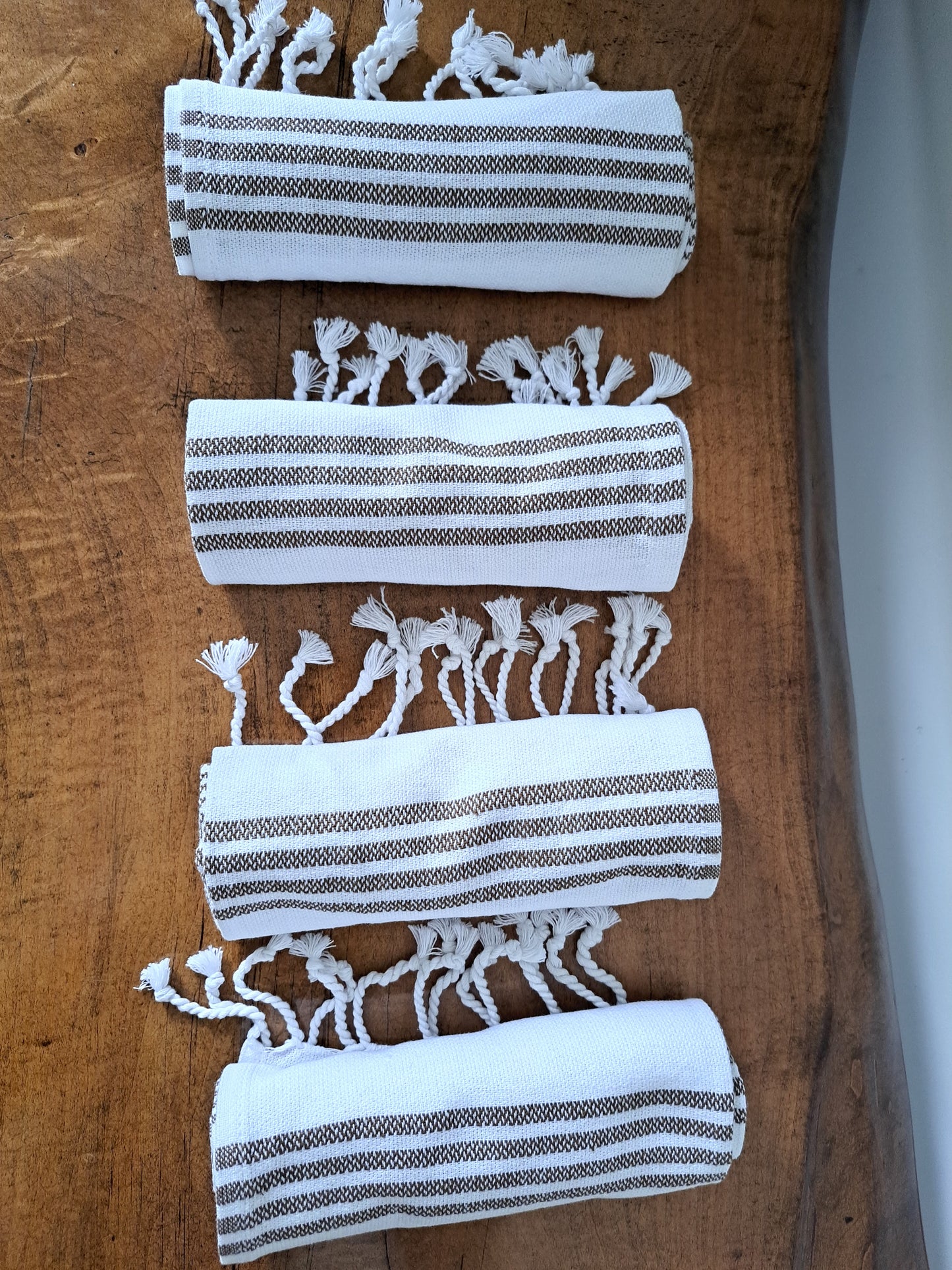 These brown striped handwoven hand towels work perfectly for a farmhouse style, adding an artisanal touch to your space. Great for the kitchen or bathroom.
