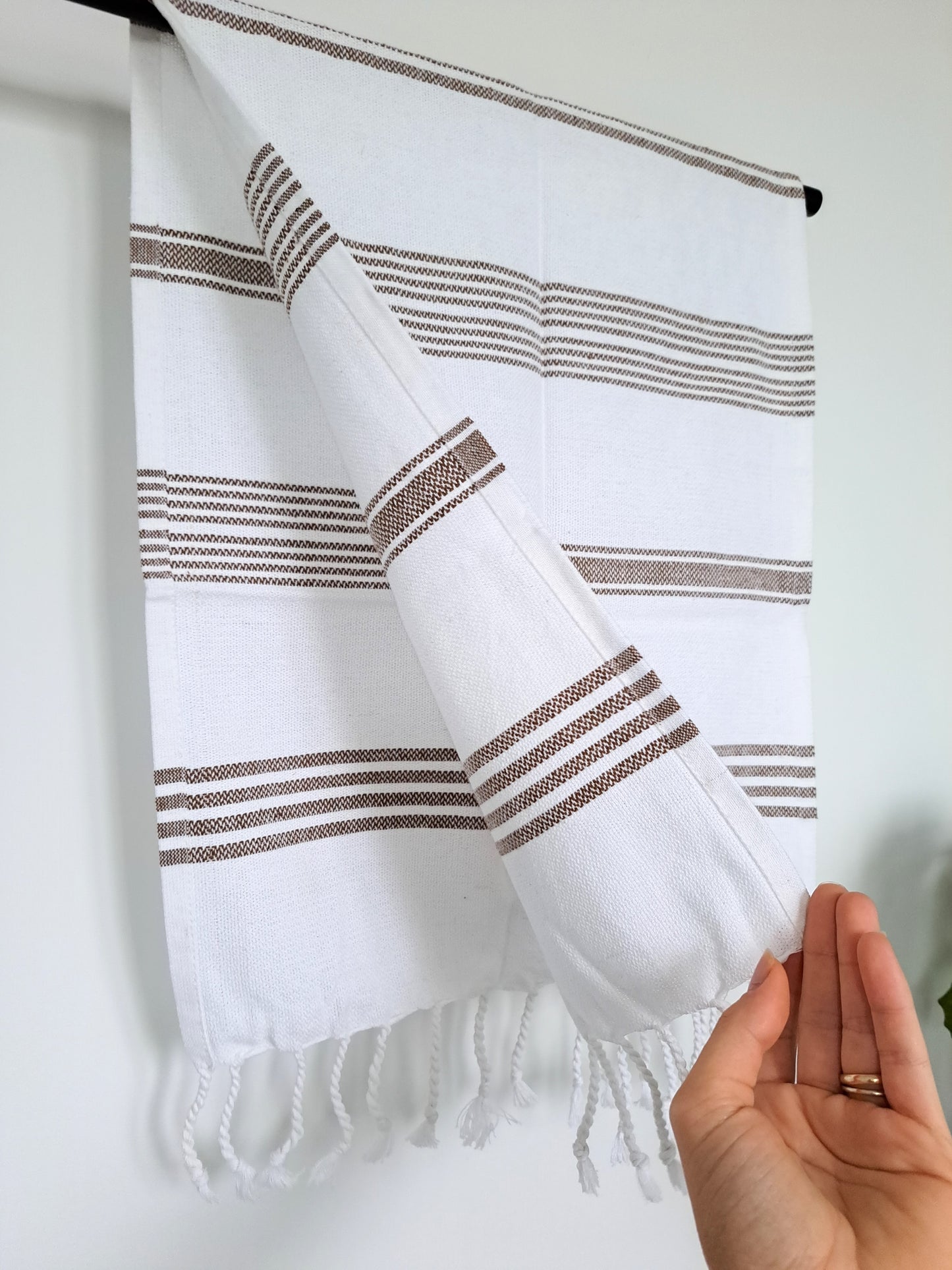 These brown striped handwoven hand towels work perfectly for a farmhouse style, adding an artisanal touch to your space. Great for the kitchen or bathroom.