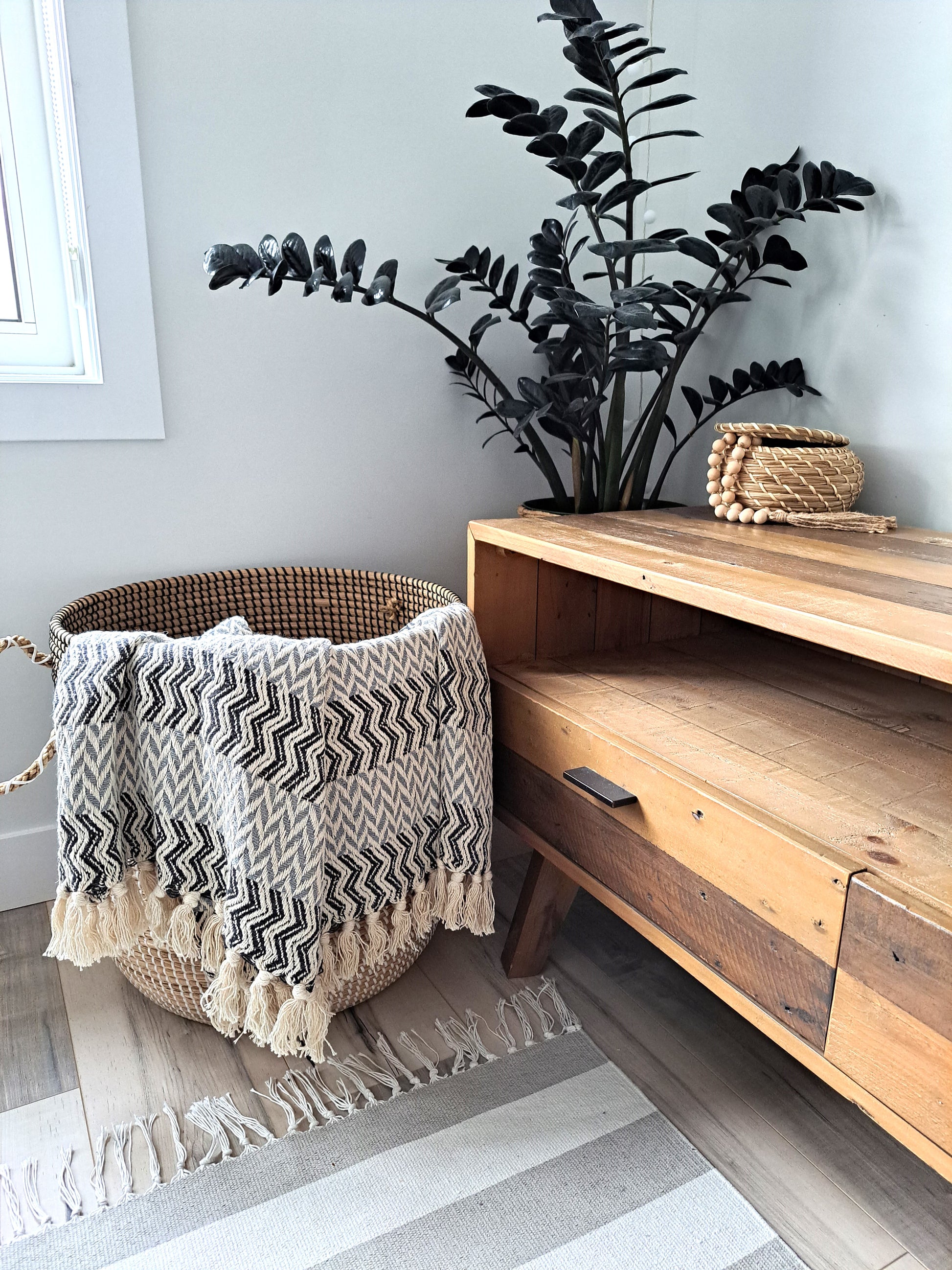 An incredibly soft and warm throw, this handwoven 100% cotton blanket adds so much texture to the space. Made with a chevron pattern, the neutral beige, grey, and subtle blue provide lots of visual interest by providing a bold, yet calming overall look. Truly an artisanal piece, and one that is sure to impress!