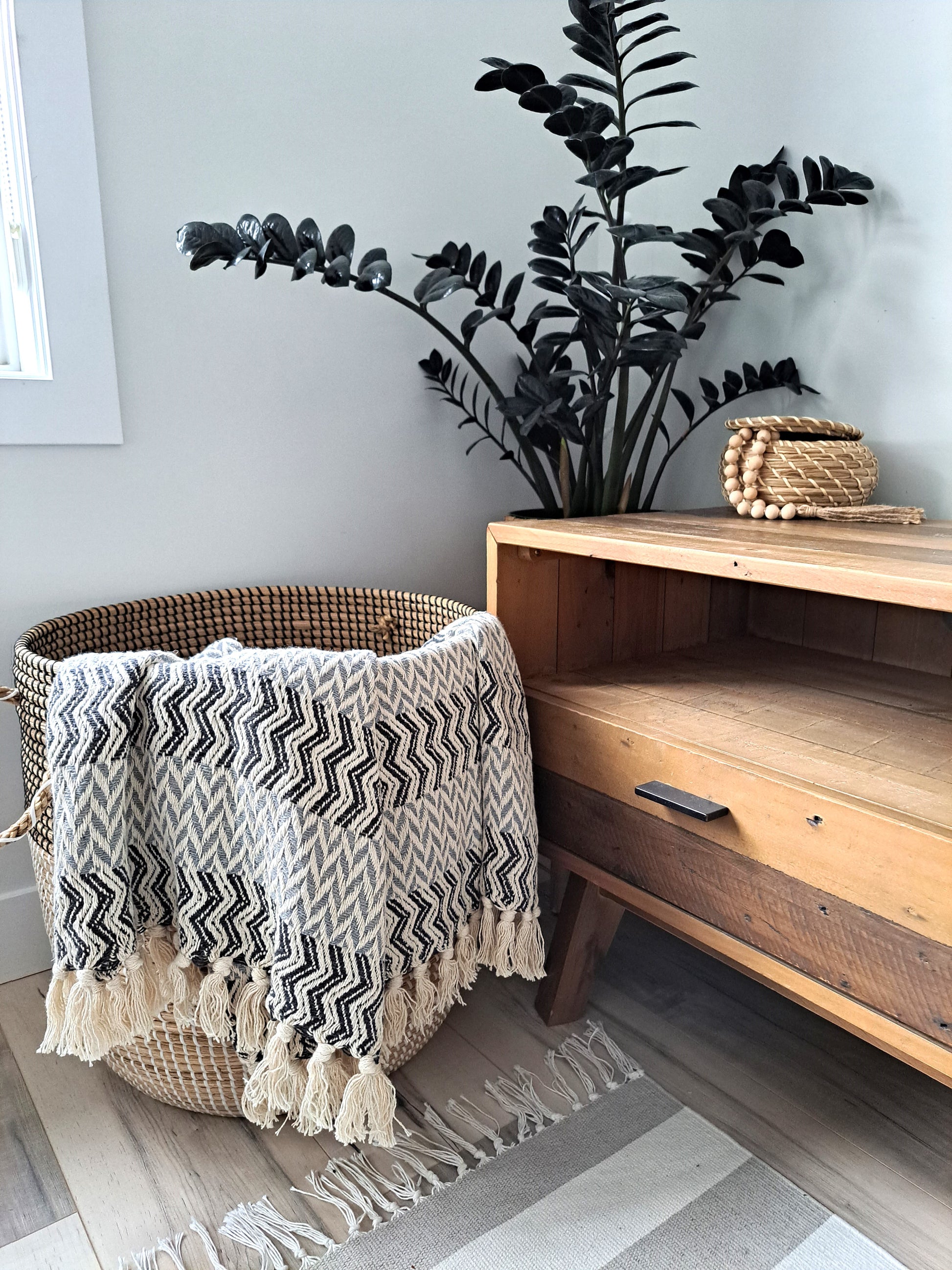 An incredibly soft and warm throw, this handwoven 100% cotton blanket adds so much texture to the space. Made with a chevron pattern, the neutral beige, grey, and subtle blue provide lots of visual interest by providing a bold, yet calming overall look. Truly an artisanal piece, and one that is sure to impress!