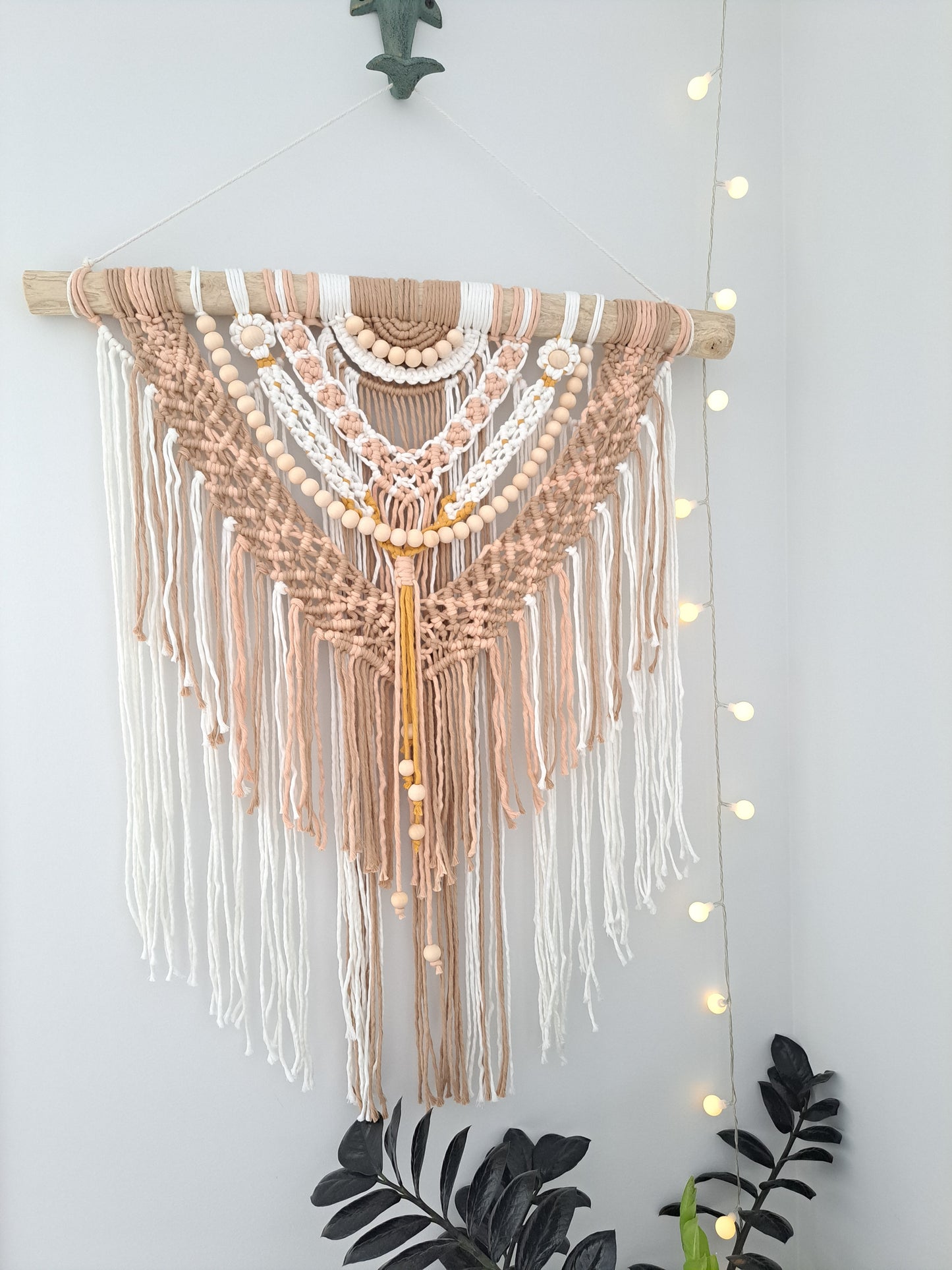 Boho Pink and Tan Macrame and Driftwood Wall Hanging. Bright and playful macrame wall hanging made with driftwood and wooden beads. Made with white, pink, tan, and mustard yellow cotton macrame.